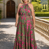 Elegantti vaaleanpunainen midi-mekko, jossa on halterneck-olkaimet